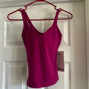 Lululemon align waist length tank top. New with tags. Magenta color.